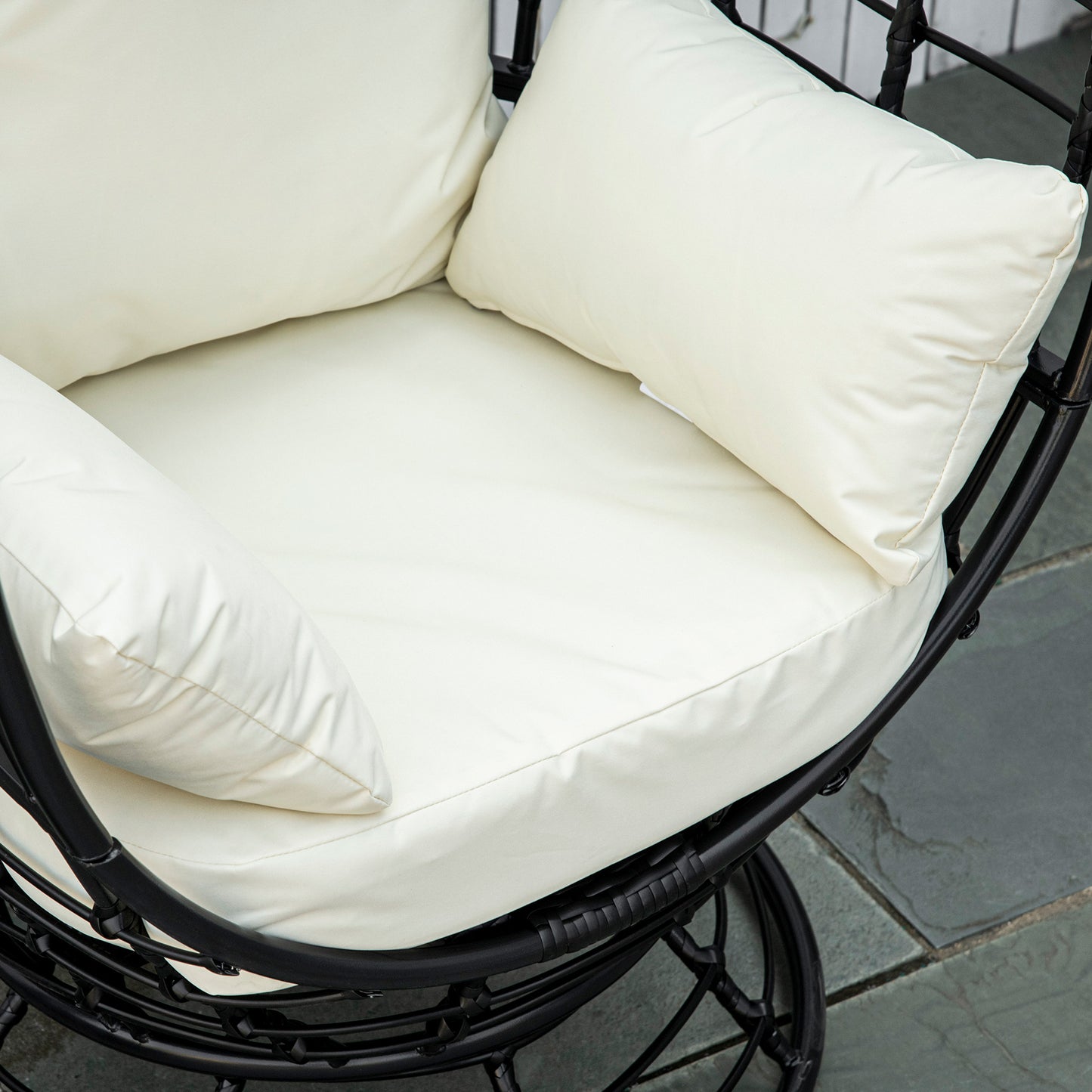 Rasu Rattan Black Swivel Egg Chair With White Cushion And Pillow