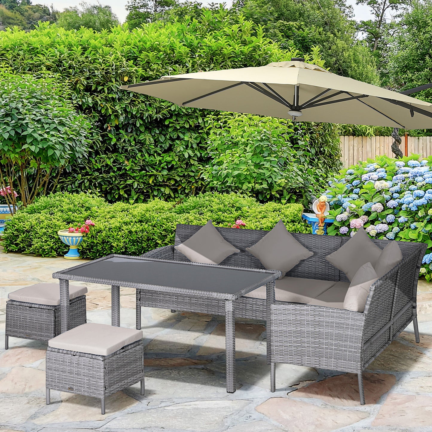Mora Rattan 7 Seater Outdoor Dining Set with Sofa 2 Footstools and Rectangular Table